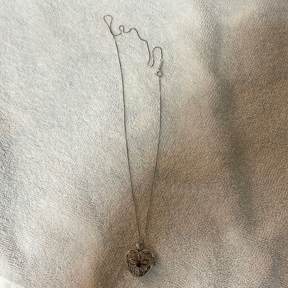 Locket silver necklace could be used for a child